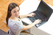teenage girl using laptop