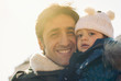 Portrait of father and young daughter outdoors In the park. 