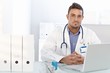 Young doctor working in office