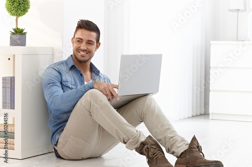 Photo: Happy man with laptop Happy man with laptop