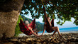 Pretty couple is laying on the hammocks