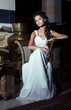 Wedding Style. Bride sitting in White Dress. Restaurant Interior