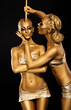 Fantasy. Creativity. Shiny Women's Gold Gilded Bodies. Arts