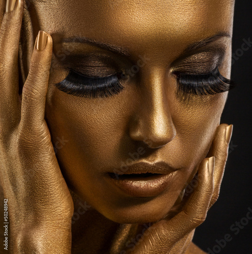 Photo: Gilt. Golden Woman's Face. Giled Make-up. Painted Skin Gilt. Golden Woman's Face. Giled Make-up. Painted Skin