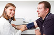 Photo: Blood pressure measuring. Doctor and patient. Blood pressure measuring. Doctor and patient.