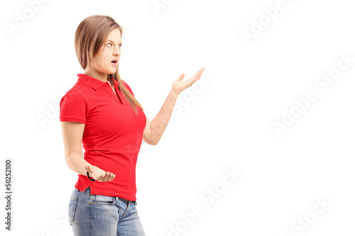 Photo: Upset young female trying to give explanation Upset young female trying to give explanation