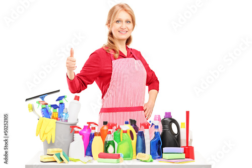 Photo: Woman posing with cleaning supplies and giving a thumb up Woman posing with cleaning supplies and giving a thumb up