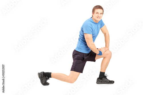 Photo: Young fit man exercising Young fit man exercising