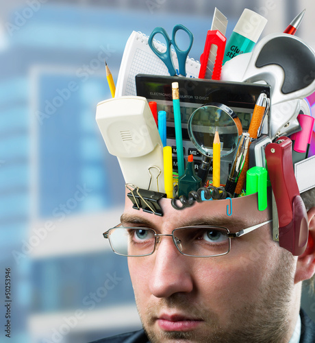 Photo: Businessman with accessories in head Businessman with accessories in head