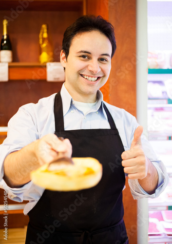 Photo: Shopkeeper serving a customer Shopkeeper serving a customer