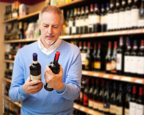 Photo: Man choosing wine Man choosing wine