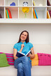 thoughtful woman holding pen and notebook