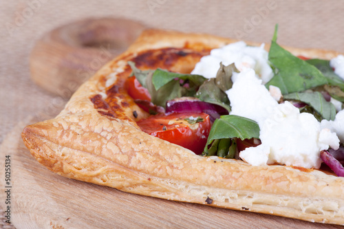 Photo: puff pastry with rocket close up puff pastry with rocket close up