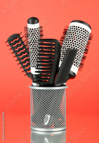 Photo: Iron basket with combs and round hair brushes, Iron basket with combs and round hair brushes,