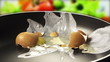 Raw egg falls on the pan