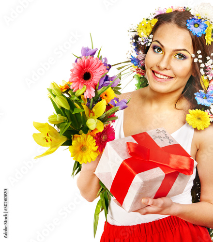 Photo: Woman with gift box and flower bouquet . Woman with gift box and flower bouquet .