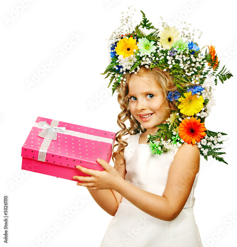 Photo: Child with gift box and flower. Child with gift box and flower.
