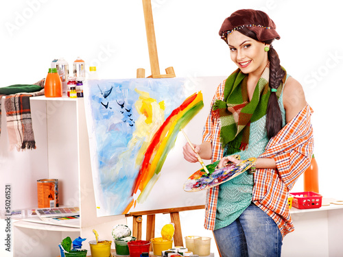 Photo: Female artist at work. Female artist at work.