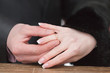 Newly-married couple on wedding dresses gold rings