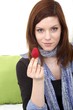 young beautiful woman with a strawberry