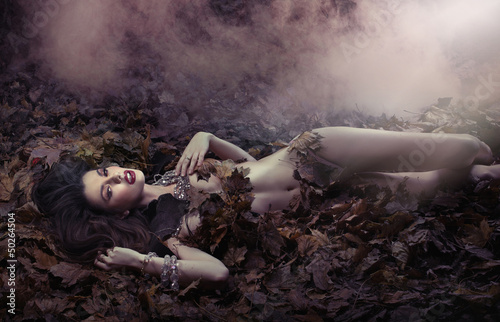 Photo: Fantastic shot of sensual woman on the leaf's duvet Fantastic shot of sensual woman on the leaf's duvet