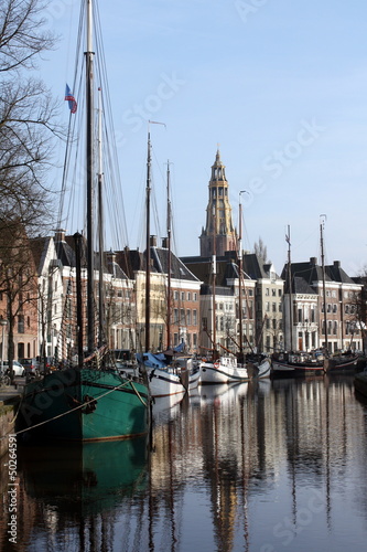 Photo: Ships and canalhouses in the city Groningen.The Netherlands Ships and canalhouses in the city Groningen.The Netherlands