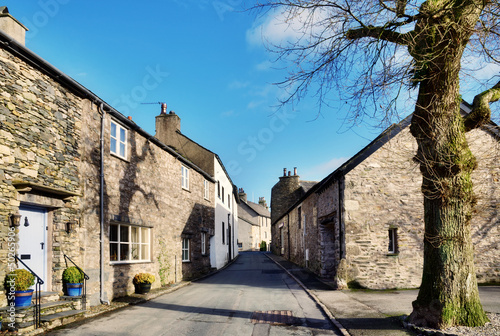 Photo: View of a street in Cartmel, Cumbria with tree View of a street in Cartmel, Cumbria with tree