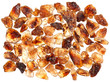 Brown lump cane sugar crystals, food ingredient background