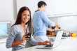 laptop kitchen couple