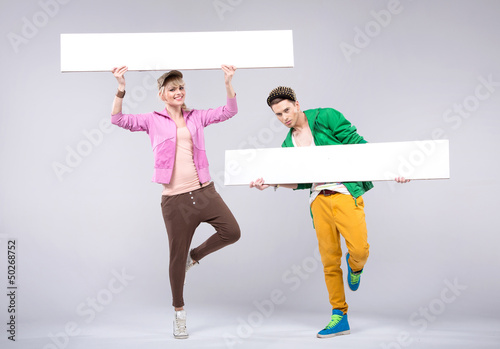Photo: Cheerful teenagers wearing colorful clothes Cheerful teenagers wearing colorful clothes