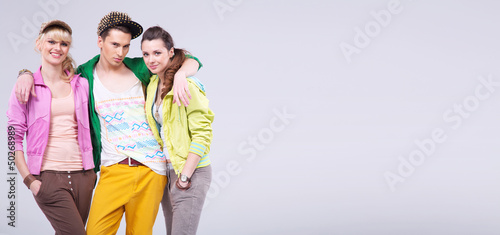 Photo: Relaxed teenagers hugging and smiling Relaxed teenagers hugging and smiling