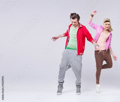 Photo: Relaxed couple of teenager in dance pose Relaxed couple of teenager in dance pose