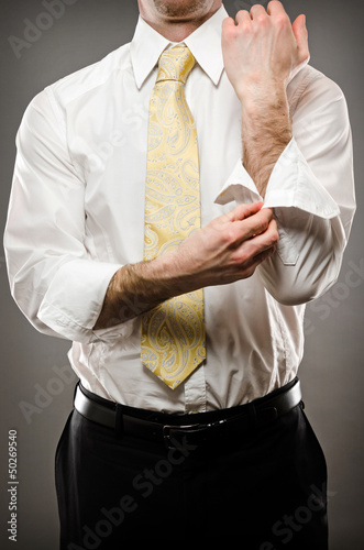 Photo: Man rolling up his sleeves Man rolling up his sleeves