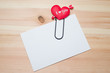 Empty note on wooden background
