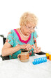 Disabled Senior Examining Her Medication