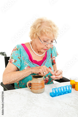 Photo: Disabled Senior Examining Her Medication Disabled Senior Examining Her Medication