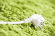 Photo: Green carpet on Power Plug Saving energy Green carpet on Power Plug Saving energy