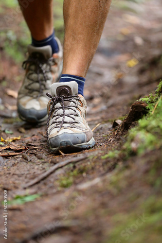 Photo: Hiker - hiking shoes closeup from hike walk Hiker - hiking shoes closeup from hike walk