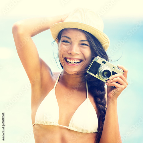 Photo: Beach woman with vintage retro camera Beach woman with vintage retro camera