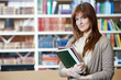 female student girl with books in library