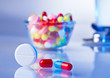 Pills and tablets macro still life on white blue, medical therap