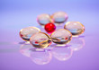 Pills (capsules) of cod-liver oil on violet, macro view with sel