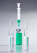 Ampoule and syringe macro still life on white