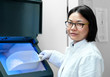 Photo: Oriental scientist by ice machine Oriental scientist by ice machine