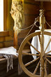 vintage traditional spinning wheel, distaff with yarn in wooden