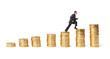 Businessman goes up the gold coins