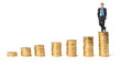 Businessman on top the gold coins