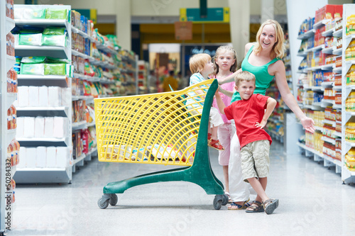Photo: woman and children making shopping woman and children making shopping