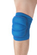 Knee protection in games on the male leg. Close-up. On a white b