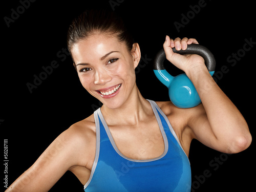 Photo: Fitness cross fit woman holding kettlebell Fitness cross fit woman holding kettlebell